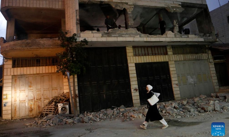 Palestinians inspect the ruins of a house demolished by Israeli army forces in the West Bank city of Hebron, Oct. 6, 2025. (Photo by Mamoun Wazwaz/Xinhua)