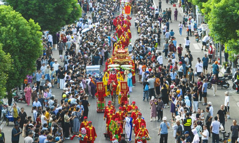 An aerial photo taken on Oct. 6, 2025 shows performers in traditional costumes during a parade in Ningbo, east China's Zhejiang Province. (Photo by Zheng Kaixia/Xinhua)