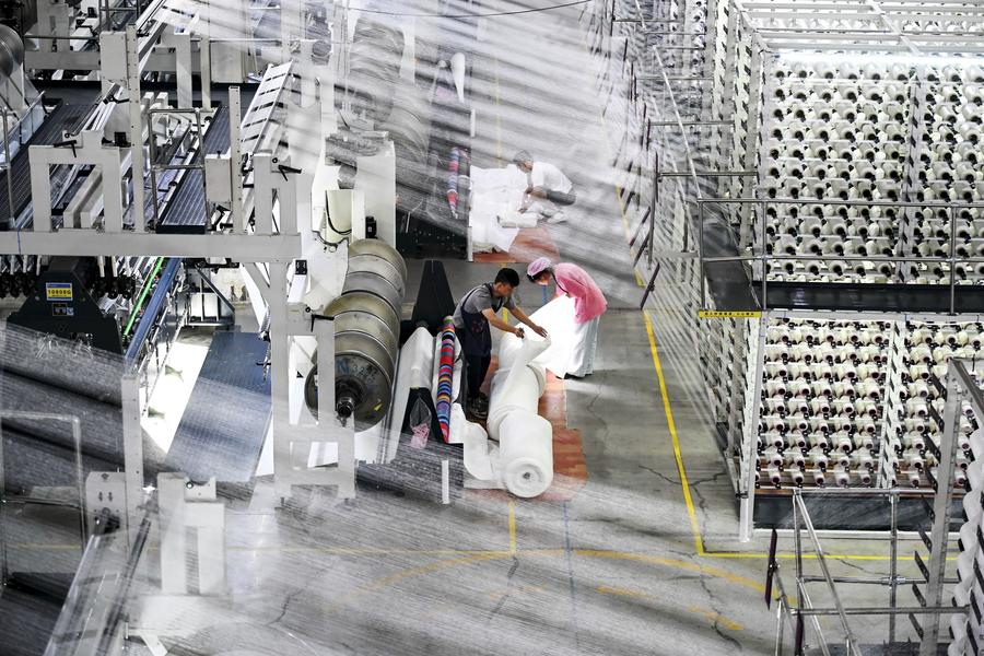 This photo taken on Aug. 20, 2025 shows a scene at the smart workshop of SinceTech, a shoe material textile company, in Jinjiang, southeast China's Fujian Province. (Photo: Xinhua)