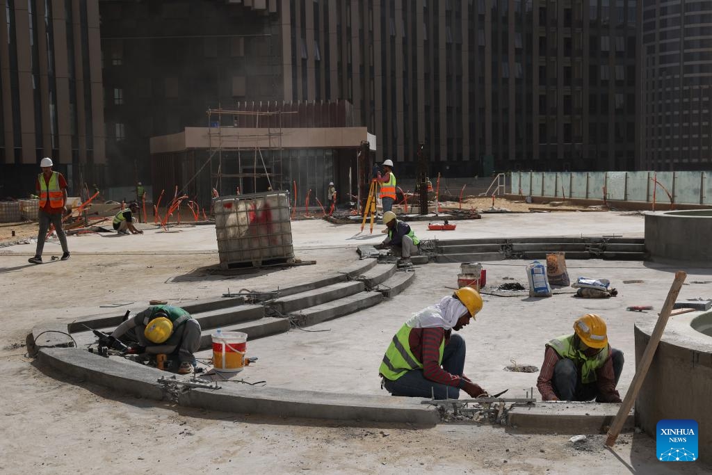Workers work at a construction site of the Central Business District (CBD) project in the new administrative capital on the outskirts of Cairo, Egypt, on Oct. 5, 2025. (Photo by Li Binghong/Xinhua)