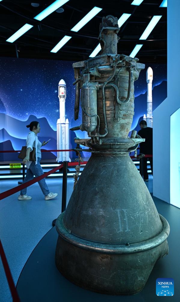 This photo taken on Oct. 7, 2025 shows remains of a rocket displayed at the Wenchang Aerospace Science and Education Center in Wenchang, south China's Hainan Province. The upgrade project of the Wenchang Aerospace Science and Education Center is nearing completion. In preparation for its official opening, the center is open to the public free of charge for a limited time, allowing visitors to experience its operation and services firsthand. Following the renovation, the exhibition now features immersive experiences in aerospace history, rocket launches, space science and future exploration. (Xinhua/Pu Xiaoxu)