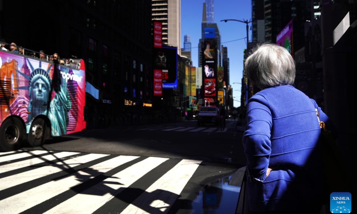 A woman walks on a street in New York, the United States, Oct. 1, 2025. Photo: Xinhua