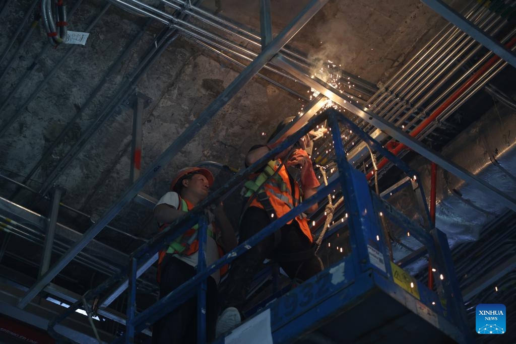 Workers work at a construction site of the Central Business District (CBD) project in the new administrative capital on the outskirts of Cairo, Egypt, on Oct. 5, 2025. (Photo by Li Binghong/Xinhua)