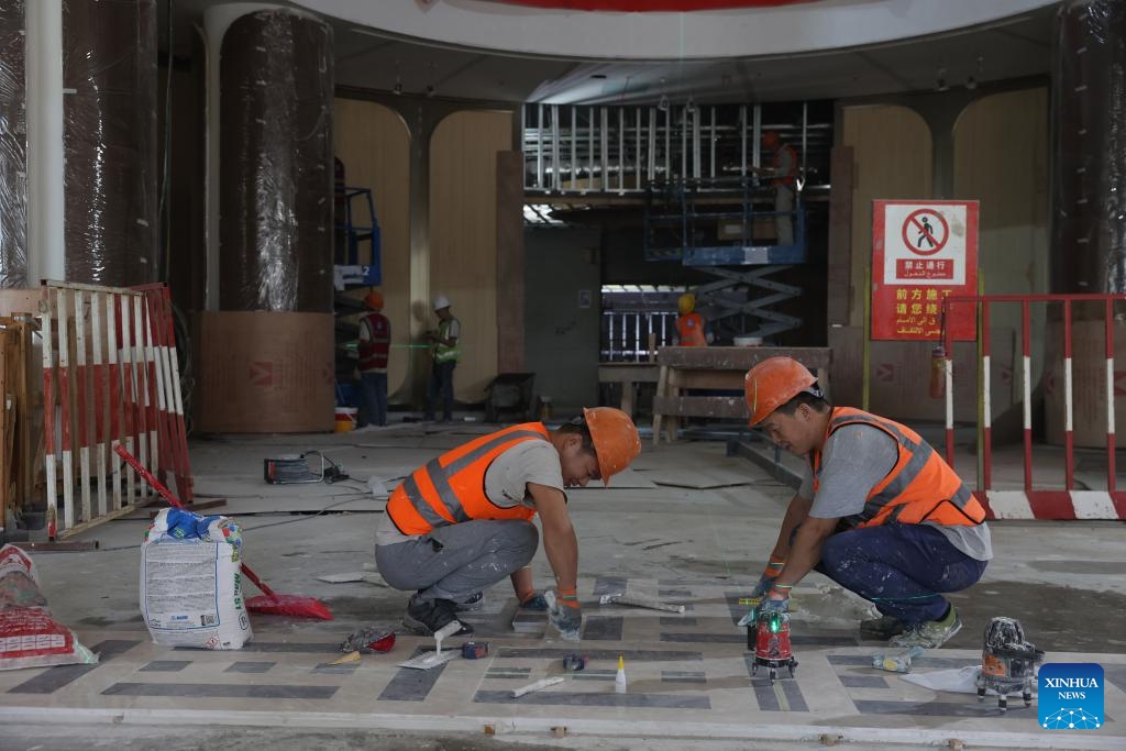Workers work at a construction site of the Central Business District (CBD) project in the new administrative capital on the outskirts of Cairo, Egypt, on Oct. 5, 2025. (Photo by Li Binghong/Xinhua)