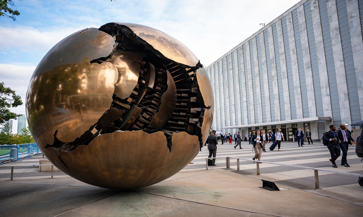 People walk around the plaza by the Sphere Within Sphere outside the United Nations Headquarters on the first day of the 80th session of the UN General Assembly's High-Level week on September 22, 2025. Photo: VCG 