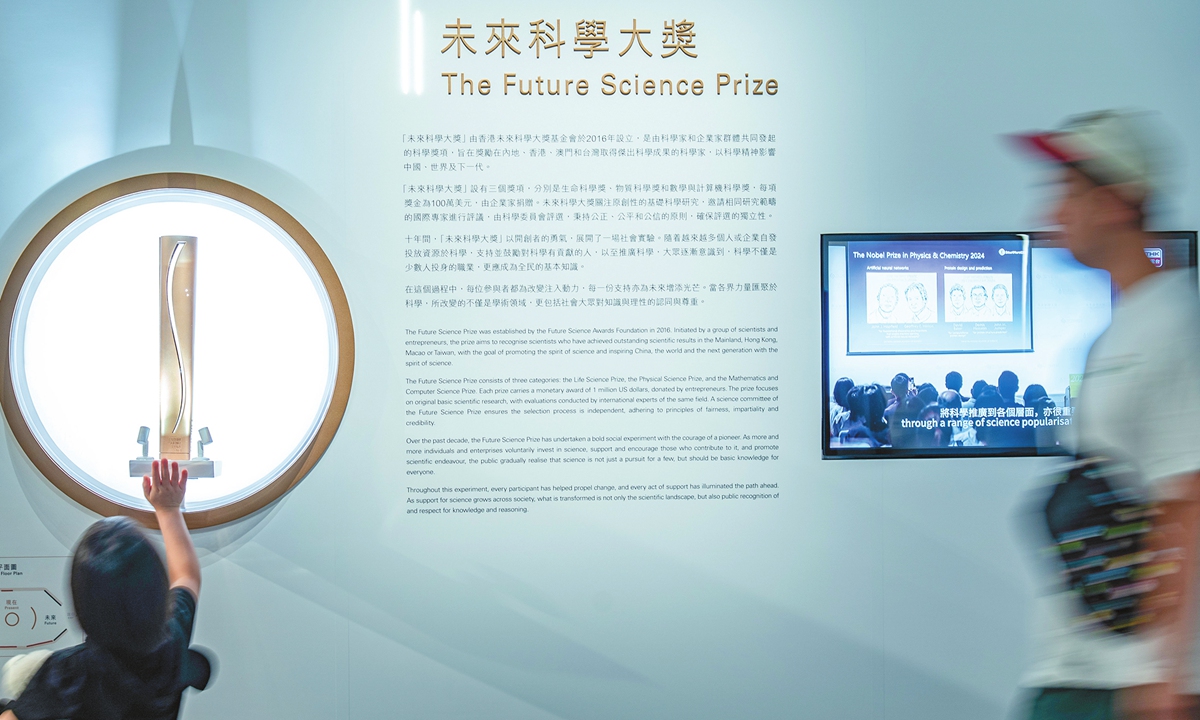 A child examines a replica of the 