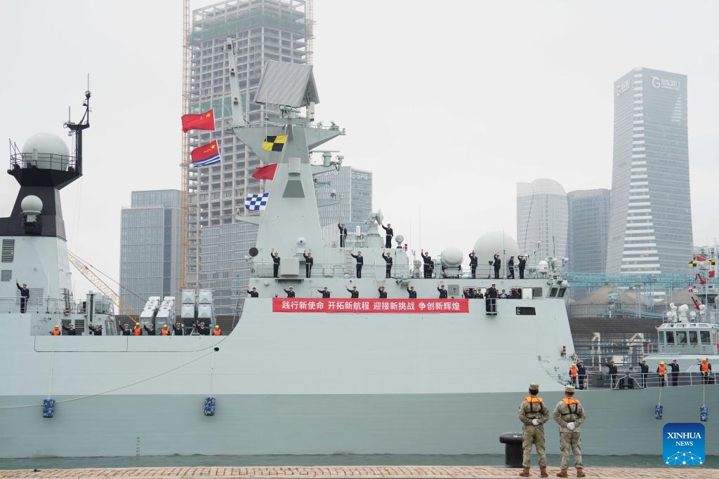 Officers and soldiers wave goodbye at a port in Qingdao, east China's Shandong Province, Oct. 11, 2025. A new fleet of the Chinese People's Liberation Army Navy set sail from a military port in Qingdao, east China's Shandong Province, on Saturday to take over an escort mission from the previous fleet in the Gulf of Aden and waters off Somalia. This 48th navy fleet comprises a missile destroyer, a missile frigate and a supply vessel -- with two helicopters and dozens of special forces members on board (Photo: Xinhua)