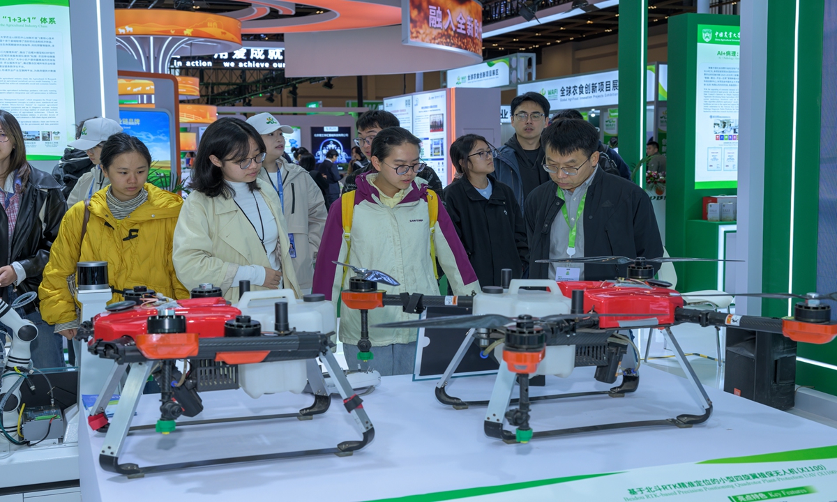 Visitors check out agricultural supplies at the World Agrifood Innovation Expo in Beijing on October 12, 2025. Held from October 12 to 15, the event centers on the theme of