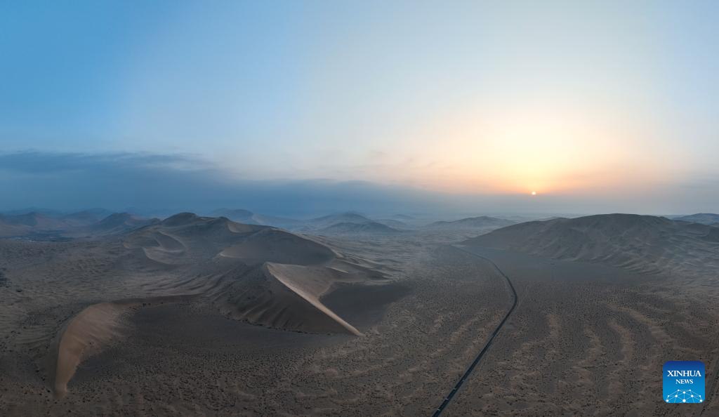 A drone photo taken on Oct. 22, 2025 shows a sunrise view of the Badain Jaran Desert in Alxa Right Banner, the Alxa League of north China's Inner Mongolia Autonomous Region. The Badain Jaran Desert was included on the World Heritage List in July 2024. (Xinhua/Bei He)