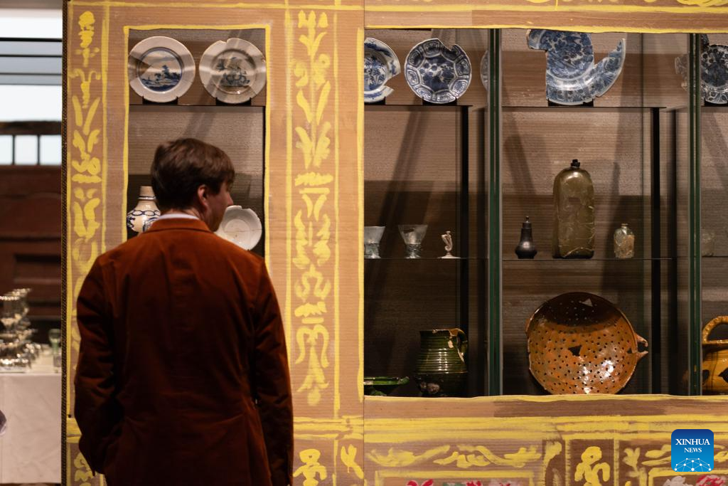 A visitor views exhibits during the media preview of the exhibition At Home in the 17th Century at the Rijksmuseum in Amsterdam, the Netherlands, Oct. 14, 2025. The exhibition, which showcases the lives of people in the Netherlands in the 17th century, will be open to the public from Oct. 17, 2025 to Jan. 11, 2026. (Photo by Sylvia Lederer/Xinhua)