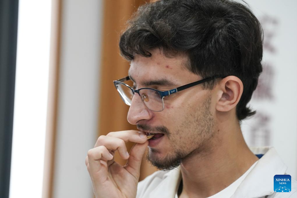 Kerbouche Abdeldjalil, an international student from Algeria, learns to identify the traditional Chinese herb Huangqi, or Astragalus root, at Anhui University of Chinese Medicine in Hefei, east China's Anhui Province, Oct. 16, 2025. More than 140 students from around the world are systematically learning traditional Chinese medicine (TCM) theory at the School of Humanities and International Education Exchange at Anhui University of Chinese Medicine. The school provides bilingual courses combining TCM theories and clinical practice for international students. Meanwhile, various cultural activities have been organized for them to enhance their understanding of TCM.

So far, some graduates have returned to their home countries and are working in local healthcare services. (Xinhua/Du Yu)