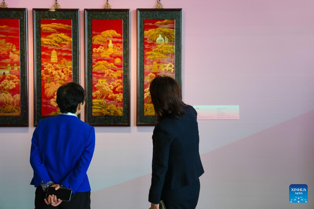 Women visit Heritage Blossoms, Women Shine, a special exhibition celebrating the Global Leaders' Meeting on Women in Beijing, capital of China, Oct. 13, 2025. The Global Leaders' Meeting on Women was held in Beijing on Monday. (Xinhua/Yan Linyun)