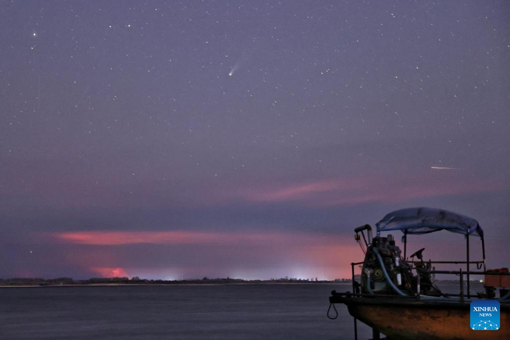 This photo taken on Oct. 20, 2025 shows the comet C/2025 A6 (Lemmon) and a meteor shower in the sky over Tongjiang City, northeast China's Heilongjiang Province. (Photo by Liu Wanping/Xinhua)