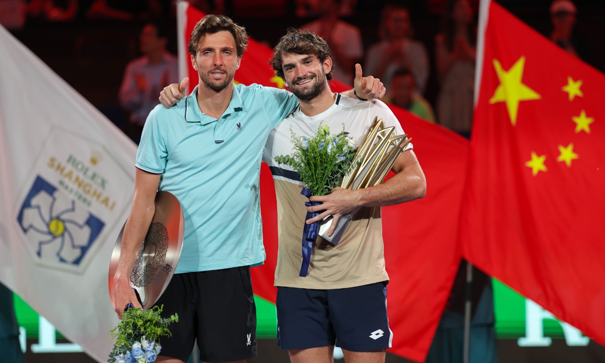 Champion Valentin Vacherot of Monaco and runner-up Arthur Rinderknech of France pose with their trophies during the awarding ceremony after the Men's Singles Final match on day 14 of the 2025 Shanghai Rolex Masters at Qi Zhong Tennis Center on October 12, 2025 in Shanghai, China. Photo: VCG