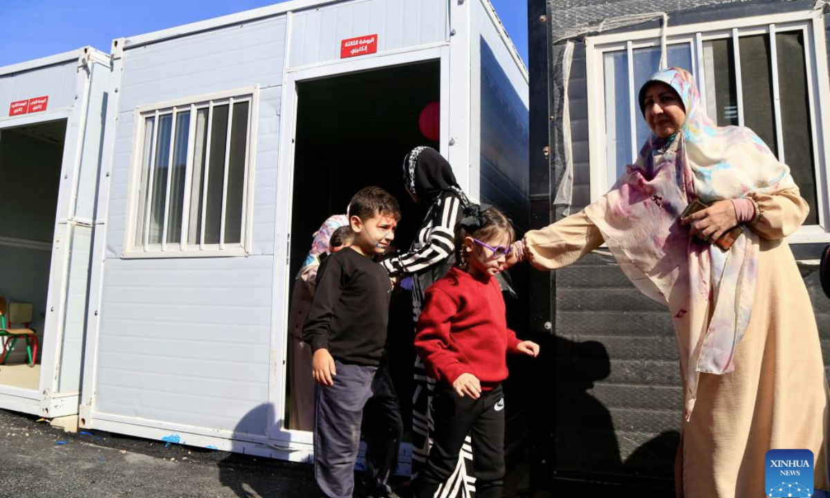 Students attend their first day of classes at a temporary school in Meiss El Jabal, southern Lebanon, Oct. 20, 2025. The temporary school here was established to replace three schools destroyed by Israeli strikes last year, allowing students to resume their studies in the new school year. (Photo by Ali Hashisho/Xinhua)