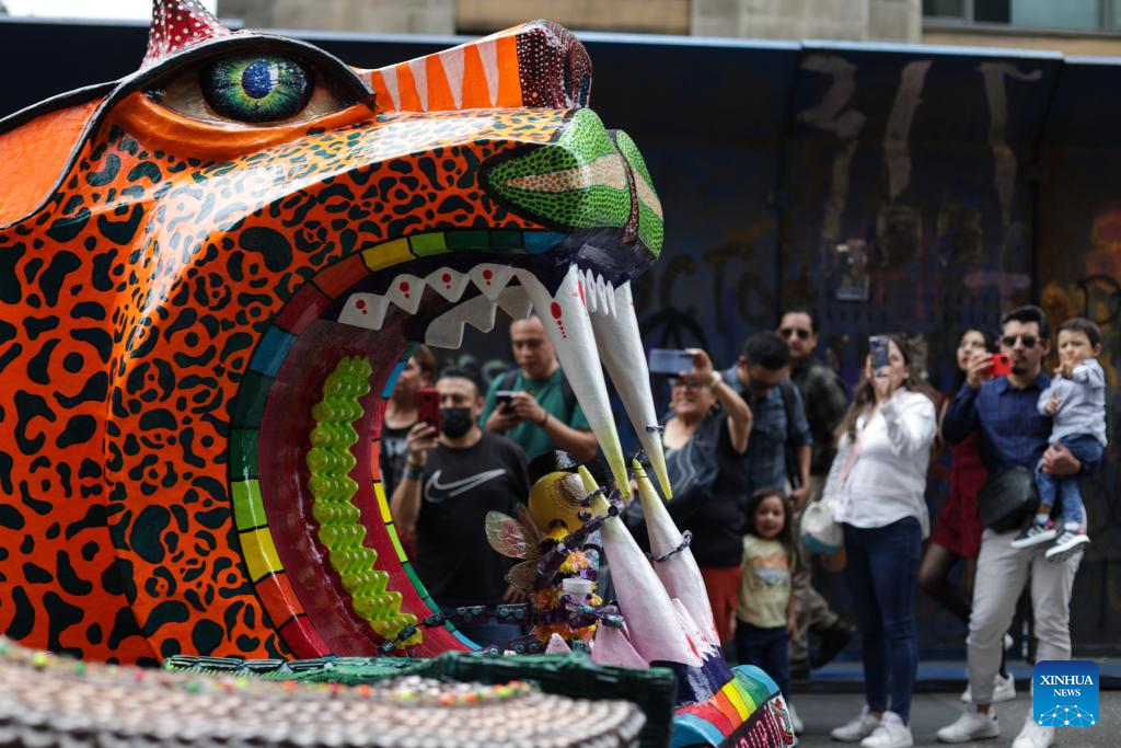 An alebrije is seen during the Monumental Alebrijes Parade 2025 in Mexico City, Mexico, Oct. 18, 2025.
Alebrijes are brightly colored folk art sculptures of fantastical creatures. (Photo by Francisco Canedo/Xinhua)