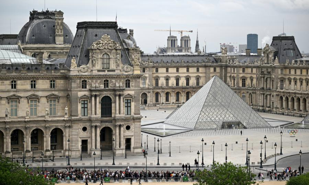 The Louvre Museum is seen before the opening ceremony of the Paris 2024 Olympic Games in Paris, France, July 26, 2024. (Photo by Xia Yifang/POOL/Xinhua)