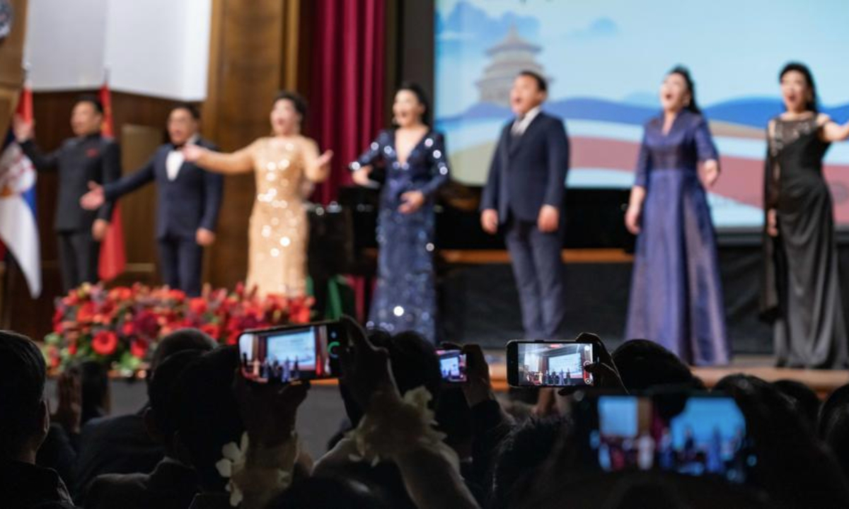 People take photos as artists perform during a concert celebrating the 70th anniversary of friendship between China and Serbia at Kolarac Concert Hall in Belgrade, Serbia, Oct. 21, 2025. (Photo by Wang Wei/Xinhua)