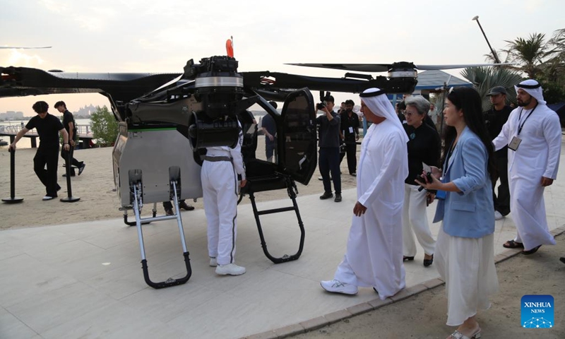 People view a flying car developed by Chinese company XPENG AEROHT in Dubai, the United Arab Emirates, Oct. 12, 2025. A flying car developed by Chinese company XPENG AEROHT on Sunday took to the skies over Dubai, the United Arab Emirates (UAE), marking a significant step in the global reach of China's low-altitude aircraft technology. (Photo: Xinhua)