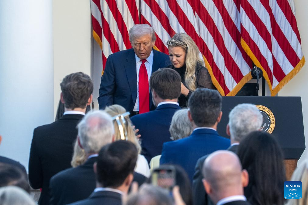 U.S. President Donald Trump walks with Erika Kirk, wife of Charlie Kirk, after posthumously awarding the Presidential Medal of Freedom to Charlie Kirk in the Rose Garden of the White House, in Washington, D.C., the United States, Oct. 14, 2025. (Xinhua/Hu Yousong)