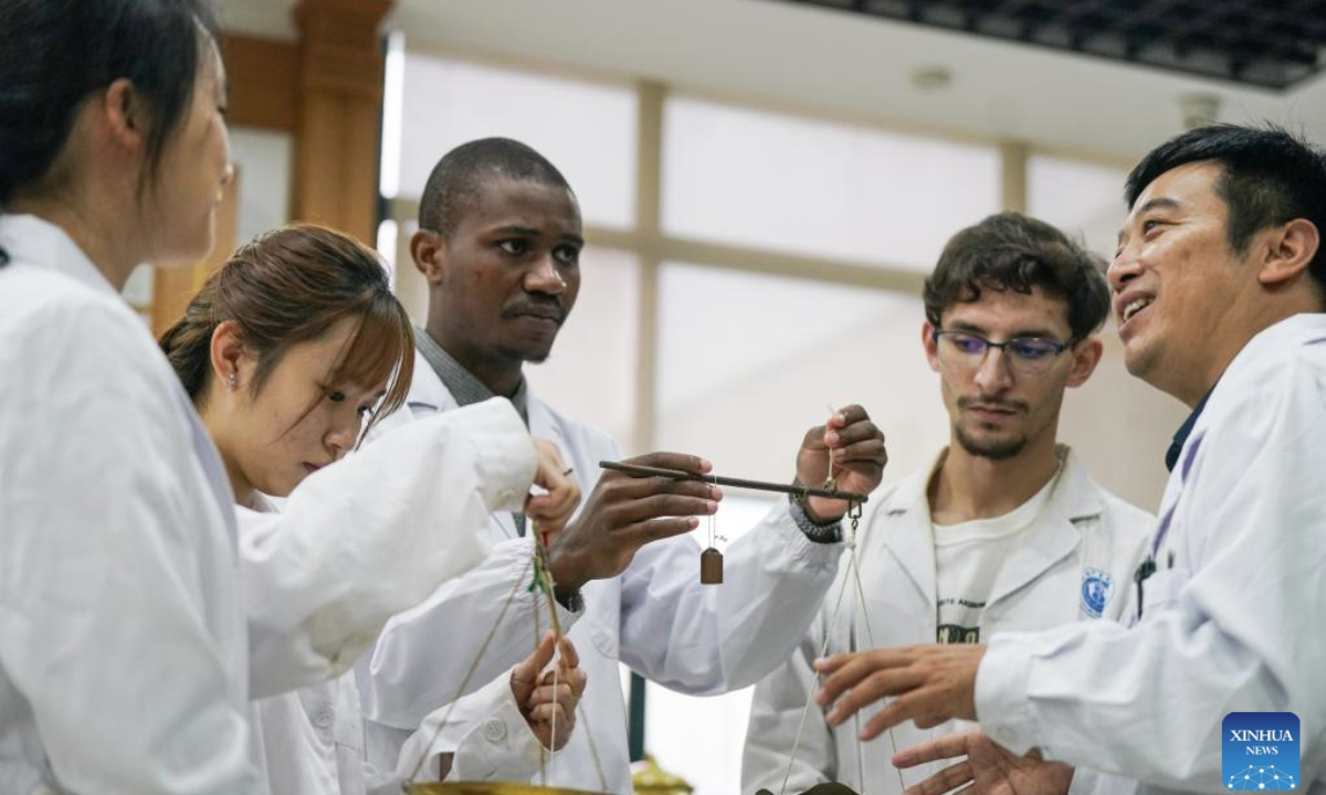 Pan Yinxing (1st, R), a lecturer from Anhui University of Chinese Medicine, teaches international students to use a steelyard in Hefei, east China's Anhui Province, Oct. 16, 2025. More than 140 students from around the world are systematically learning traditional Chinese medicine (TCM) theory at the School of Humanities and International Education Exchange at Anhui University of Chinese Medicine. The school provides bilingual courses combining TCM theories and clinical practice for international students. Meanwhile, various cultural activities have been organized for them to enhance their understanding of TCM.

So far, some graduates have returned to their home countries and are working in local healthcare services. (Xinhua/Du Yu)