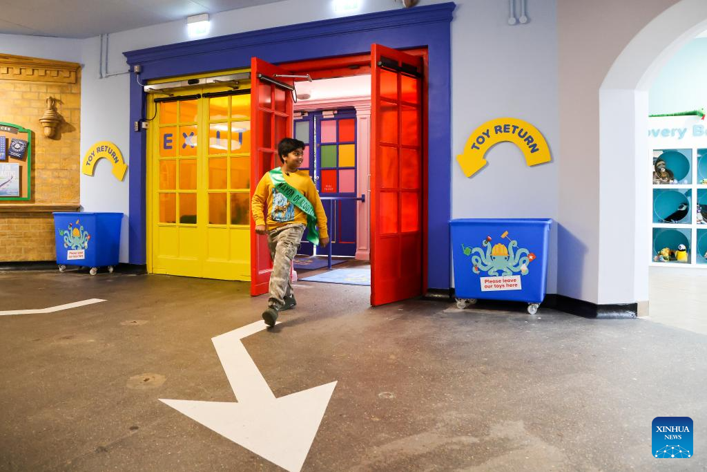 Aneeshwar Kunchala, 10-year-old conservationist and Mayor of ZooTown, patrols in an area of ZooTown at London Zoo in London, Oct. 15, 2025.
Opening to the public on Oct. 18, the ZooTown features multiple themed role-play stations where children can try their hands at working for wildlife, including preparing meals for animals in the Keeper Kitchen, fighting germs in the science lab or tracking wild animals in the field conservation station. (Xinhua)