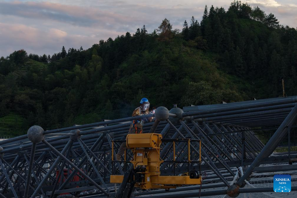 An aerial drone photo taken on Oct. 14, 2025 shows a worker working at the construction site of a station of the Quzhou-Lishui railway in Lishui, east China's Zhejiang Province. The 160-km rail line will further improve the regional railway network, effectively promote tourism development in southwestern Zhejiang. (Xinhua/Huang Zongzhi)