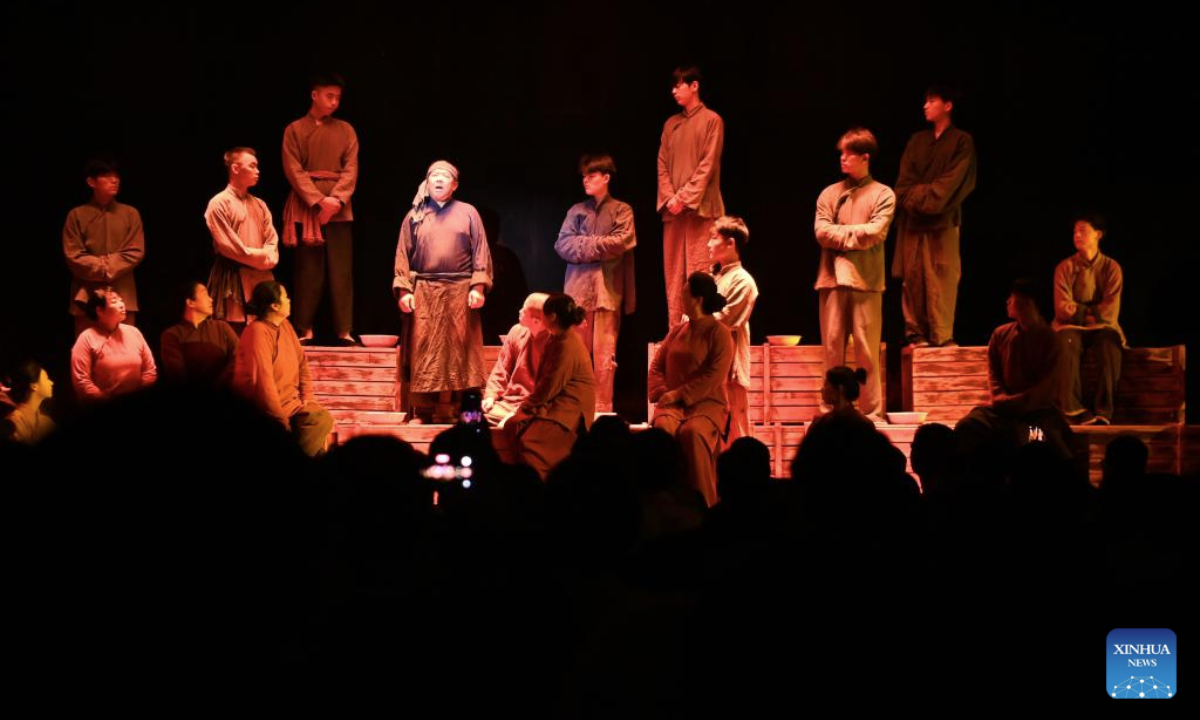 People watch the immersive drama Encore Dunhuang in Dunhuang, northwest China's Gansu Province, Oct. 15, 2025. The immersive drama Encore Dunhuang showcases Dunhuang's history, costumes, and music and dance culture. The drama have been performed over 1,000 times this year, attracting over 500,000 viewers. (Xinhua/Fan Peishen)