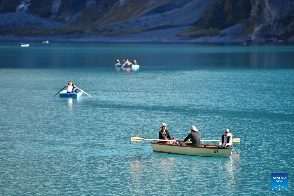 People boat on the Lake Oeschinen near Kandersteg in Bernese Oberland, Switzerland, Oct. 18, 2025.

Lake Oeschinen, situated at an altitude of 1,578 meters near Kandersteg in Switzerland's Bernese Oberland, forms part of the UNESCO World Heritage Site Swiss Alps Jungfrau-Aletsch. (Xinhua/Lian Yi)