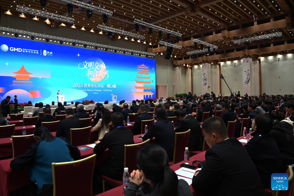 The opening ceremony of the Global Mayors Dialogue Dunhuang is held in Dunhuang, northwest China's Gansu Province, Oct. 13, 2025. A forum bringing together mayors or their representatives, diplomats and scholars from 10 countries opened on Monday in Dunhuang, a city along the ancient Silk Road in northwest China's Gansu Province.

The forum aims to discuss opportunities and challenges in cultural urban governance.

Themed A Symphony of Civilizations, Resonance in Harmony, the Global Mayors Dialogue Dunhuang focuses on practical governance issues, including leveraging cultural resources, environmental protection, green development and smart city construction. (Xinhua/Fan Peishen)