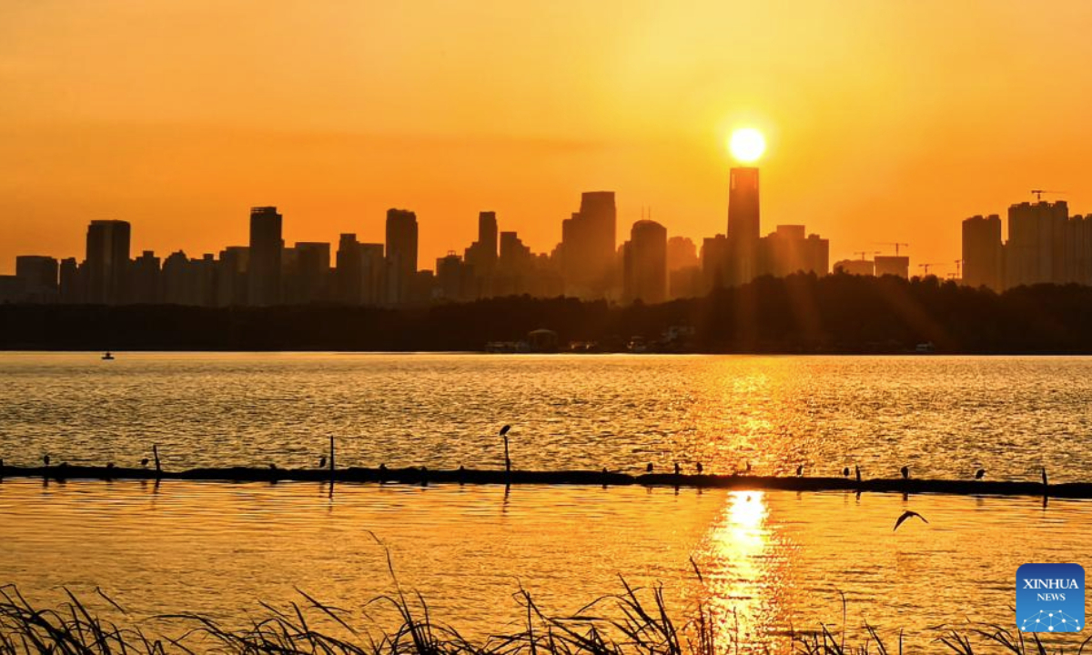 This photo taken on Oct. 22, 2025 shows Donghu Lake at sunset in Wuhan, central China's Hubei Province. (Xinhua/Shen Hongbing)