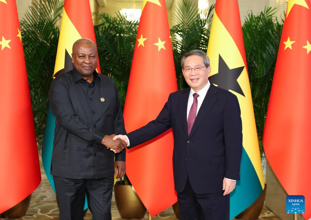 Chinese Premier Li Qiang meets with Ghanaian President John Dramani Mahama, who is here for the Global Leaders' Meeting on Women, at the Diaoyutai State Guesthouse in Beijing, capital of China, Oct. 13, 2025. (Xinhua/Huang Jingwen)