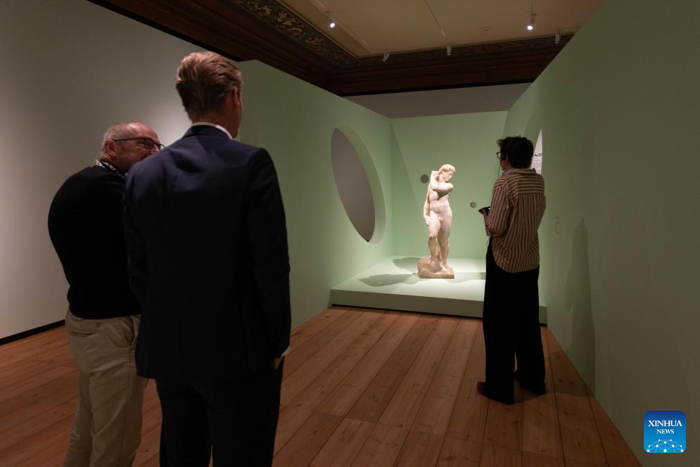 Visitors view a sculpture by Michelangelo during the media preview of the exhibition Michelangelo's Men at the Teylers Museum in Haarlem, the Netherlands, Oct. 13, 2025. The exhibition, which will be open to the public on Wednesday, showcases the works of Italian artist Michelangelo in celebration of his 550th birth anniversary. The exhibition will last until Jan. 25, 2026. (Photo by Sylvia Lederer/Xinhua)