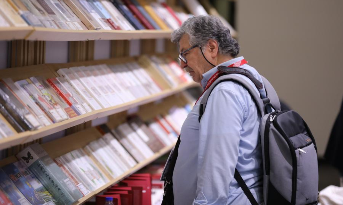 A man visits the Reading China booth at the Frankfurt Book Fair in Frankfurt, Germany, Oct. 16, 2025. (Xinhua/Du Zheyu)