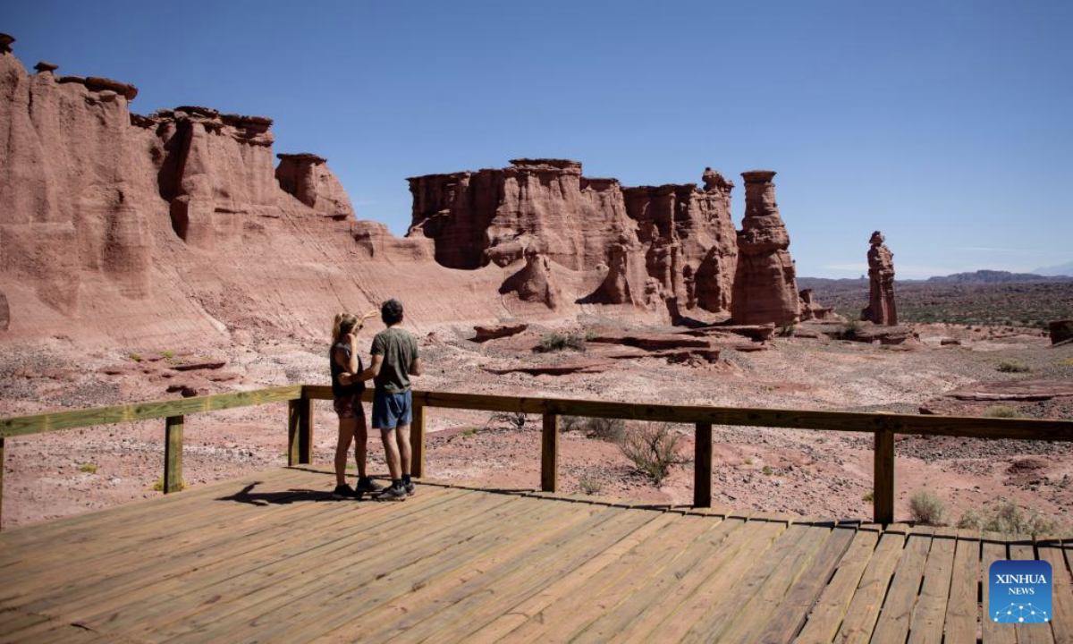 Visitors view the rock formations of the Talampaya Canyon at the Talampaya National Park in La Rioja Province, Argentina, on Oct. 11, 2025. The Talampaya National Park, covering an area of 215,000 hectares, is inscribed on the UNESCO World Heritage List. (Photo by Martin Zabala/Xinhua)