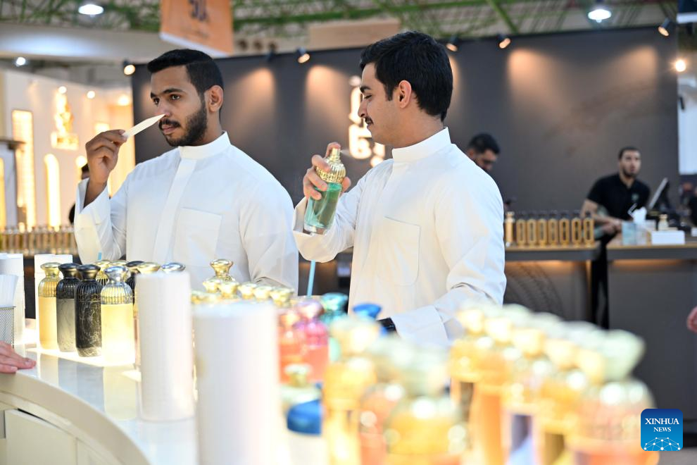 Two men try perfumes during the Perfume Expo in Hawalli Governorate, Kuwait, Oct. 21, 2025. A Perfume Expo kicked off here in Kuwait on Tuesday and will last until Nov.1 with the participation of more than 400 companies from Kuwait, Saudi Arabia, Oman, Bahrain, Qatar and the Emirates in this field. (Photo by Asad/Xinhua)