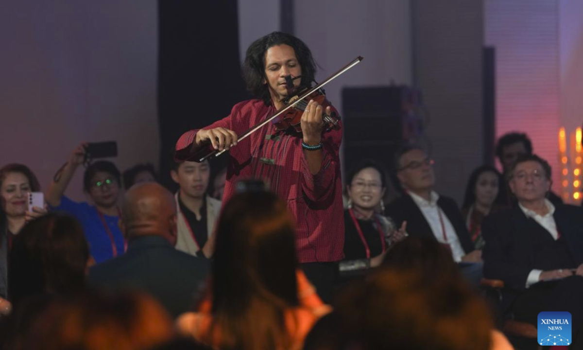French violinist Zied Zouari performs during the World Poetry, Dance, Music and Visual Arts Salon in Hangzhou, east China's Zhejiang Province, Oct. 18, 2025. The World Poetry, Dance, Music and Visual Arts Salon was held here on Saturday as a sideline event of the third Liangzhu Forum. The salon features performances and civilization dialogues, with the participation of more than 20 international artists and cultural scholars. (Xinhua/Huang Zongzhi)