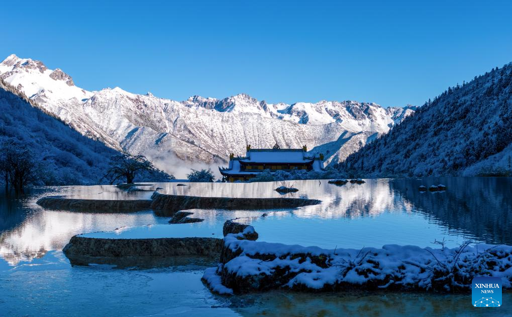 A drone photo taken on Oct. 21, 2025 shows a view of a colorful pond cluster after snow at the Huanglong scenic area in Aba Tibetan and Qiang Autonomous Prefecture, southwest China's Sichuan Province.

Huanglong witnessed the first snowfall of this autumn on Tuesday. (Photo by Sun Jiapeng/Xinhua)
