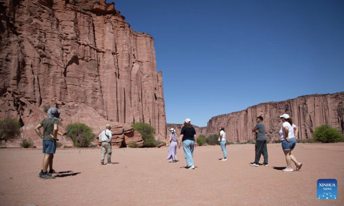 Visitors view the rock formations of the Talampaya Canyon at the Talampaya National Park in La Rioja Province, Argentina, on Oct. 11, 2025. The Talampaya National Park, covering an area of 215,000 hectares, is inscribed on the UNESCO World Heritage List. (Photo by Martin Zabala/Xinhua)