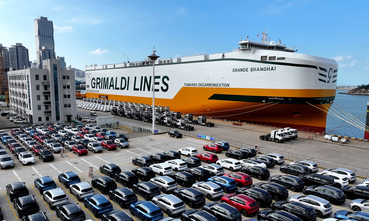 A ro-ro ship waits to load cars at a terminal of the Port of Lianyungang in East China's Jiangsu Province on October 14, 2025. In the first three quarters of 2025, China's automobile production and sales both exceeded 24 million units, while output and sales of new-energy vehicles surpassed 11 million units, data from the China Association of Automobile Manufacturers showed.