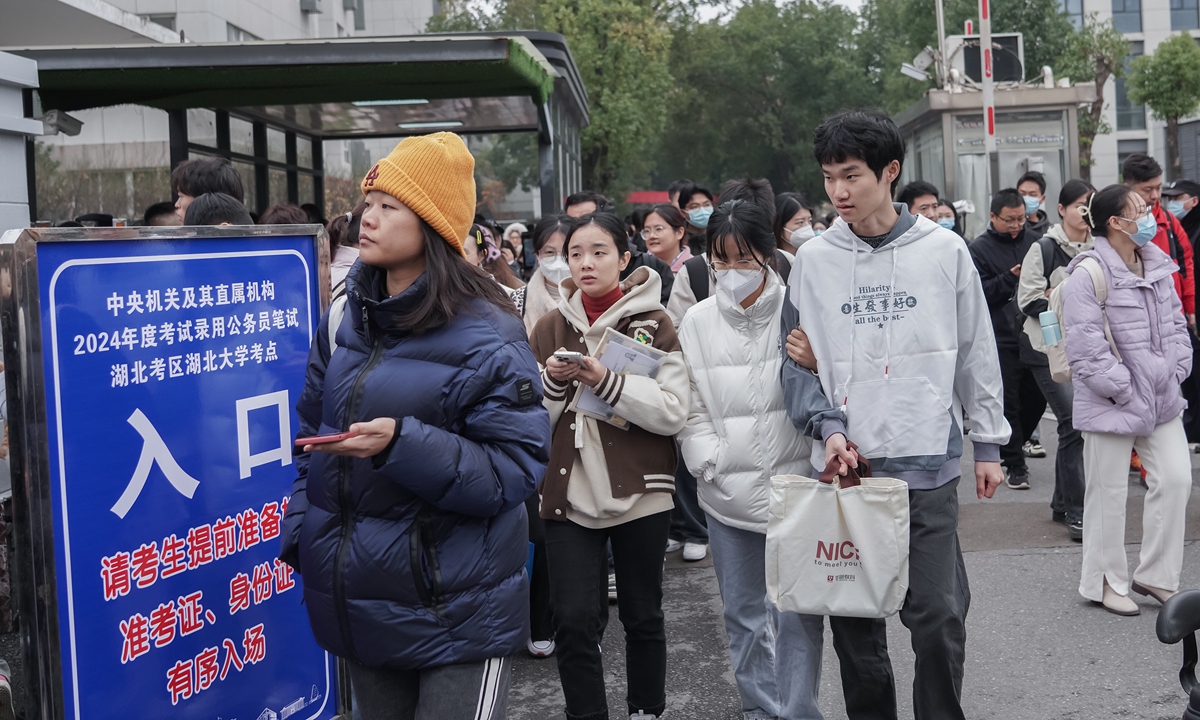 2024 national civil service exam begins on November 26, 2024. Candidates are seen leaving the examination venue at Hubei University test center on the day. File photo:  VCG

