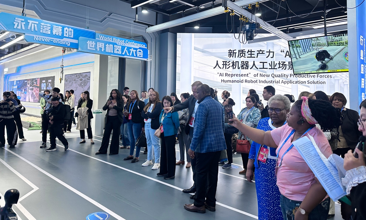 Foreign guests visit Robot World in Beijing E-Town as part of Global Leaders' Meeting on Women activities on October 14, 2025. Photo: Shen Sheng/GT
