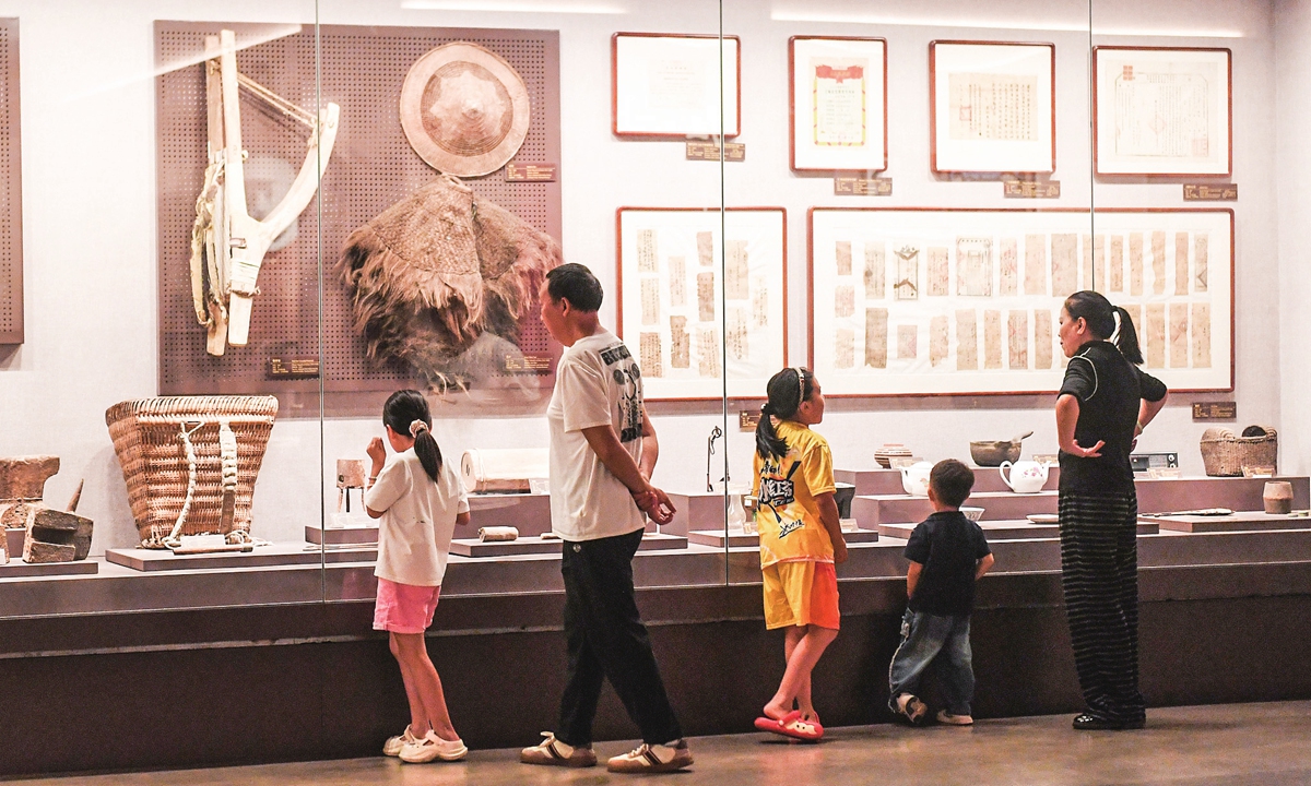 Parents and children visit the Renhuai Museum in Renhuai, Southwest China's Guizhou Province on October 7, 2025.