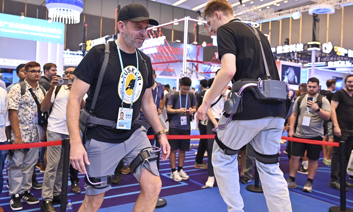 Buyers try out exoskeleton assistance devices at the 138th Canton Fair in Guangzhou, South China's Guangdong Province on October 17, 2025. Photo: VCG