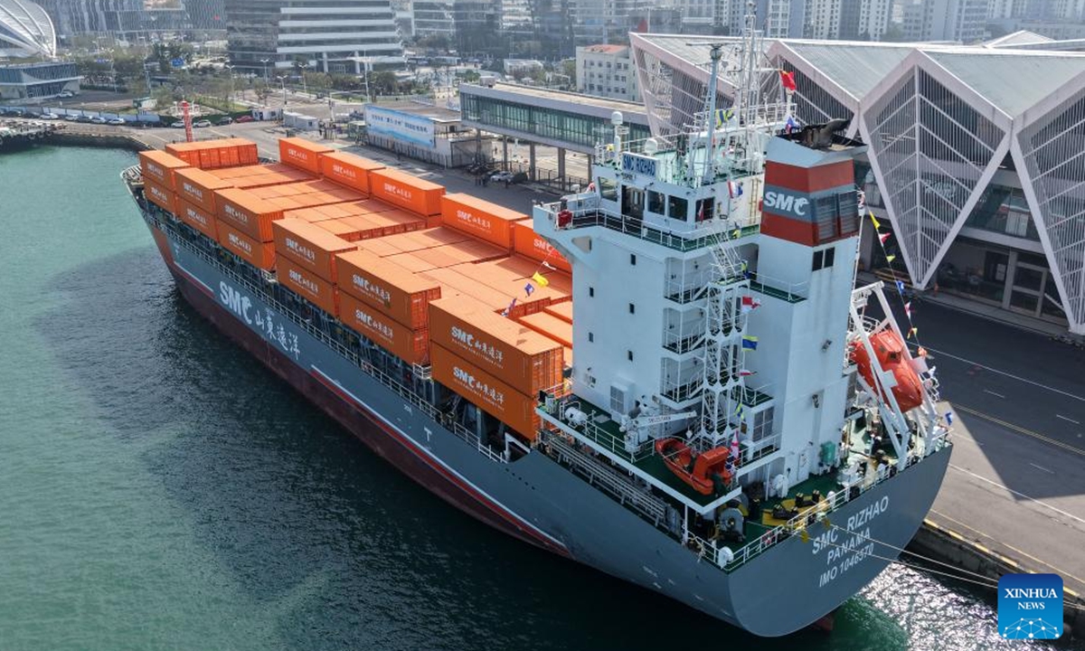 A drone photo taken on Oct. 16, 2025 shows the SMC RIZHAO ship performing the maiden voyage of the Qingdao-Jeju container shipping route berthing at the Qingdao International Cruise Terminal in Qingdao, east China's Shandong Province. A regular direct container shipping route between Qingdao and South Korea's Jeju was launched on Thursday. This express shipping route will operate once a week in its initial stage, significantly enhancing the logistics efficiency between the two places, effectively reducing logistics costs, and further densifying the shipping network of east China's Shandong Province to South Korea. (Xinhua/Li Ziheng)
