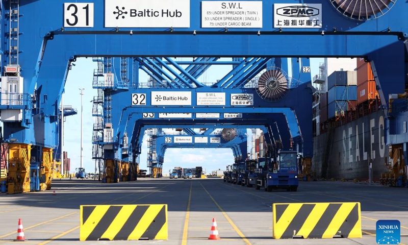 This photo taken on Oct. 19, 2025 shows trucks parking beside the Istanbul Bridge, the first vessel on the China-Europe Arctic container express route, at the Port of Gdansk, Poland. After a 26-day voyage, the first vessel on the China-Europe Arctic container express route arrived early Sunday at the Port of Gdansk, located on the Baltic Sea coast in northern Poland. (Photo: Xinhua)