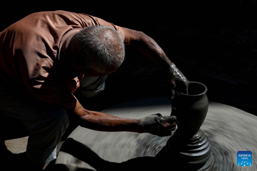 A worker makes a clay pot for Tihar, a Hindu festival of lights, in Bhaktapur, Nepal, Oct. 19, 2025. These clay pots will be used as oil lamps during Tihar.  (Photo: Xinhua)