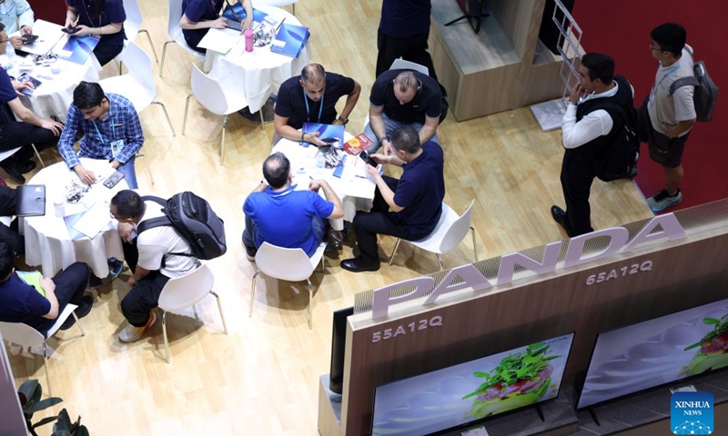 Buyers negotiate with exhibitors at the 138th edition of the China Import and Export Fair in Guangzhou, south China's Guangdong Province, Oct. 15, 2025. The first phase of the 138th edition of the China Import and Export Fair, also known as the Canton Fair, concluded on Sunday. According to statistics from China Foreign Trade Center, about 157,900 overseas buyers from 222 countries and regions attended the event offline. (Photo: Xinhua)