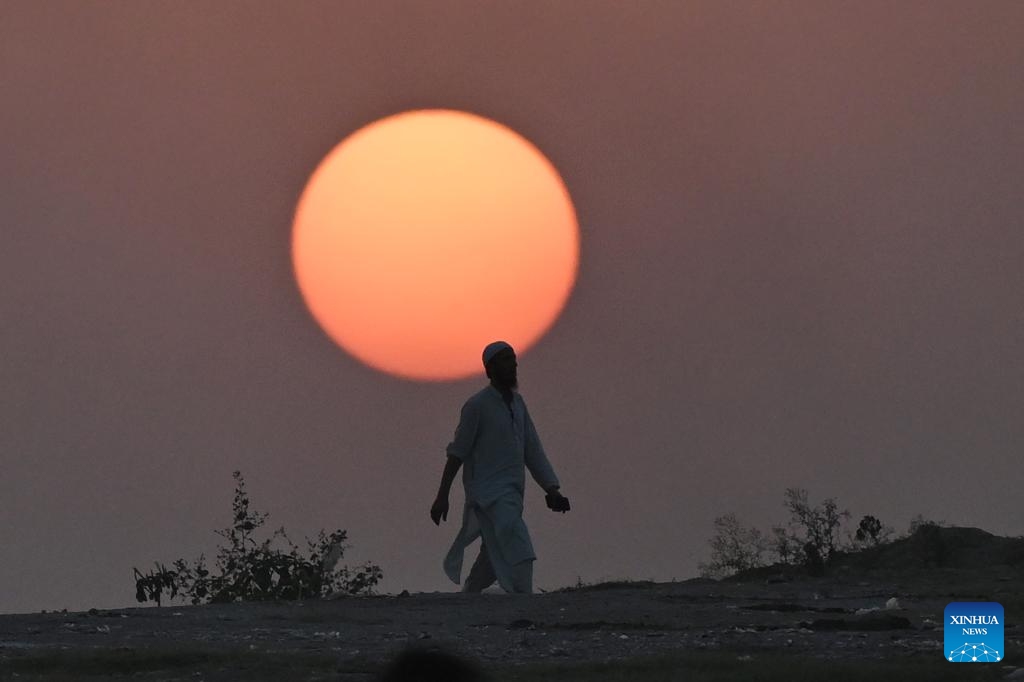 This photo taken on Oct. 19, 2025 shows the silhouette of a man walking during sunset on the outskirts of Islamabad, capital of Pakistan. (Photo: Xinhua)