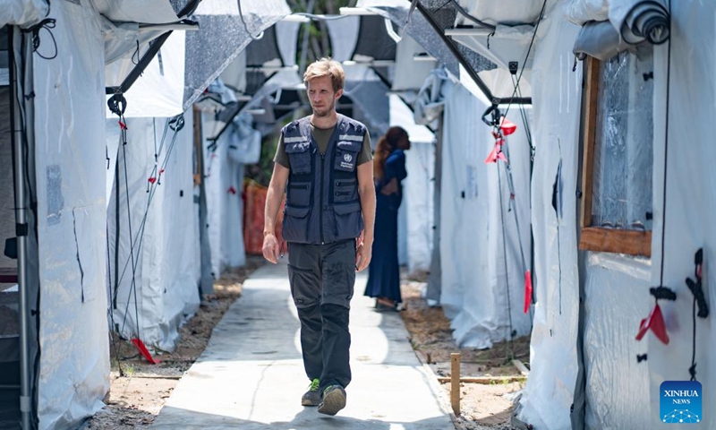 A staff member of the World Health Organization (WHO) walks through an Ebola treatment center in the Bulape health zone, the Democratic Republic of the Congo (DRC), Oct. 16, 2025. The World Health Organization (WHO) said Sunday that health authorities could declare the end of the current Ebola outbreak in the Democratic Republic of the Congo (DRC) in early December if no new cases are detected before then. (Photo: Xinhua)